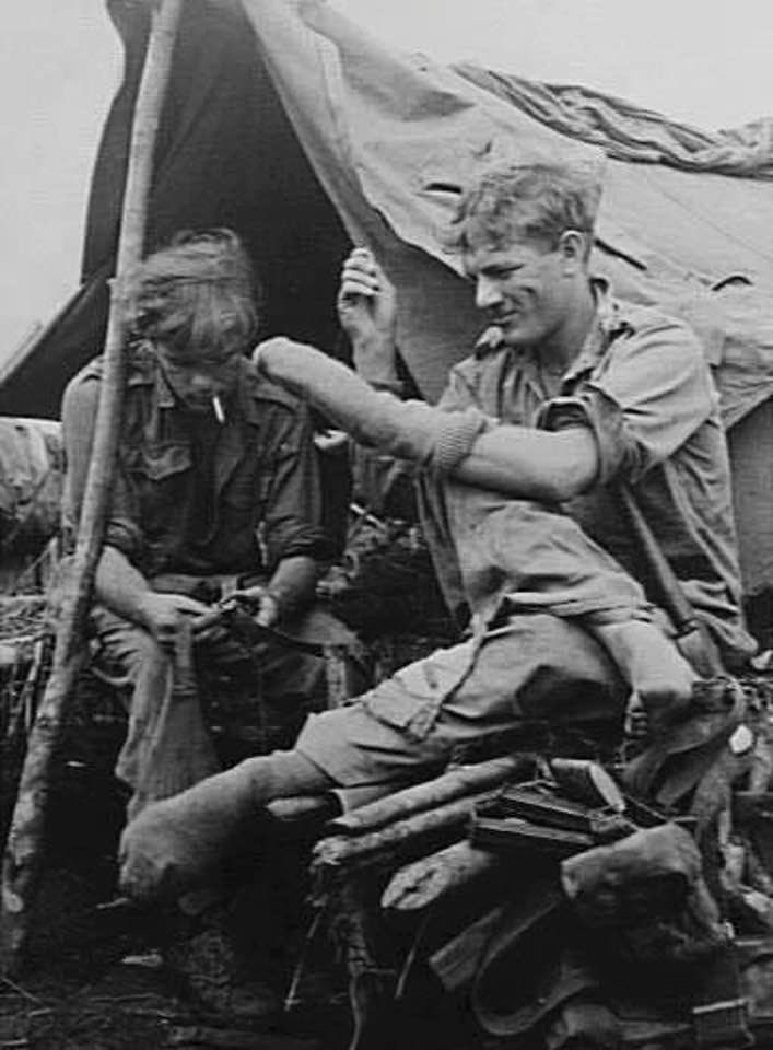 Pte Raymond Thorsby Ross, founder of the original The Last Post, left, during his time with the 2/10th in Papua New Guinea during WW2.
